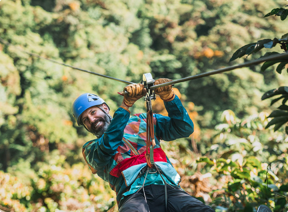 man smiling while going in a canopy